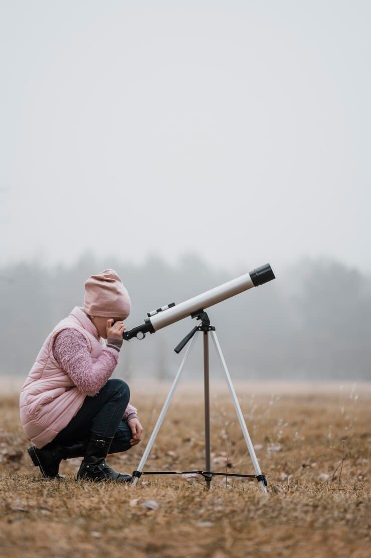 side-view-kid-using-telescope-outside_23-2148762038 (1)